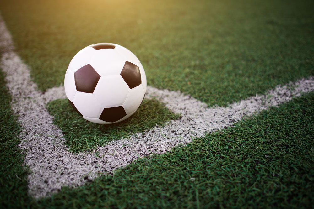 soccer-ball-on-the-white-line-at-stadium-web