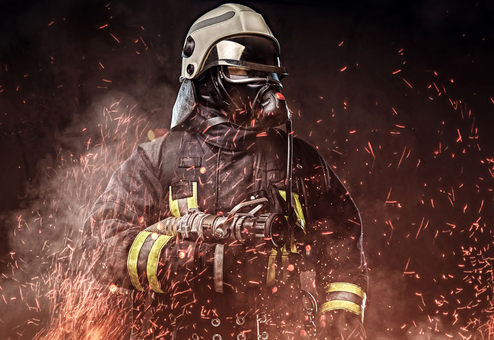 a-professional-firefighter-dressed-in-uniform-and-an-oxygen-mask-standing-in-fire-sparks-and-smoke-over-a-dark-background-web