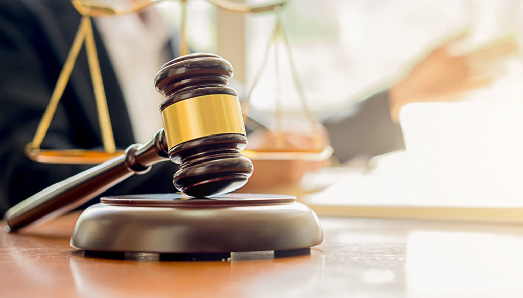 judge-gavel-with-justice-lawyers-having-team-meeting-at-law-firm-background-web