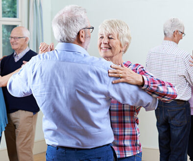Group Of Seniors Enjoying Dancing Club Together