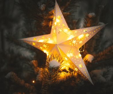 merry-christmas-christmas-star-glowing-snowy-tree-night-close-up-atmospheric-magic-winter